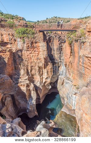 Bourkes Luck, South Africa - May 20, 2019: Unidentified Tourists On A Pedestrian Bridge Over The Tre