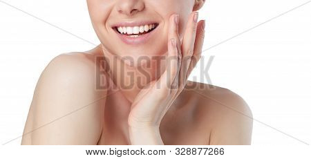 Portrait Of Beautiful Woman With Natural Make Up Touching Her Face.