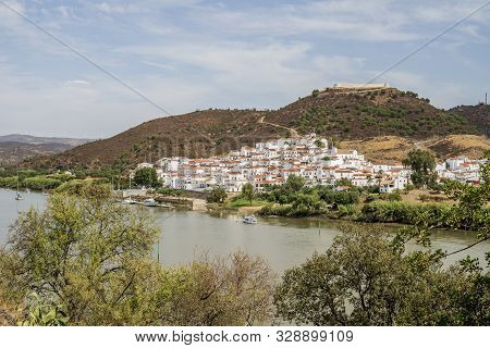 Sanlucar De Guadiana In Spain Pictured From Portuguese Side On The Opposite Side Of Guadiana River, 