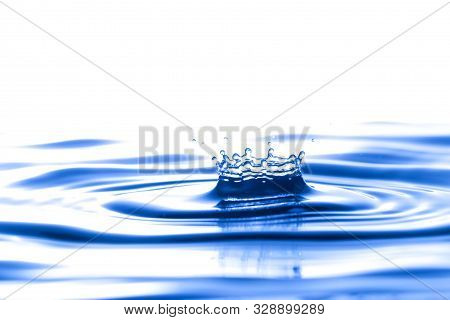 Splash Crown Shape Of Drop Water In Blue Tone, Blank Spce From Above To Create Concepttual.