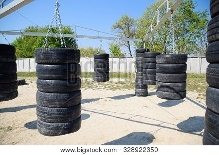 Homemade Punching Bags From Car Tires. Sports Ground In The Courtyard. Punching Bags