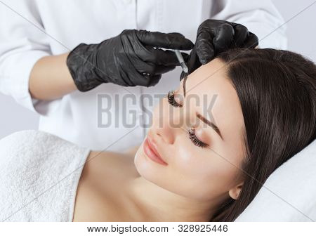 The Doctor Cosmetologist Makes The Rejuvenating Injections Procedure For Tightening And Smoothing Wr