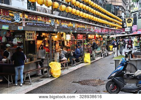 Keelung, Taiwan - November 23, 2018: People Visit Famous Miaokou Night Market In Daytime Keelung, Ta