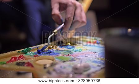 Artist Copyist Paint Seascape With Ship In Ocean. Craftsman Decorator Draw As Boat Sail On Blue Sea 
