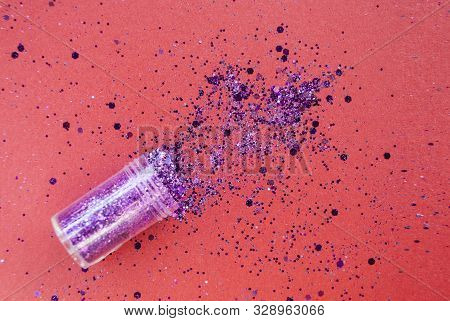 Plastic Box With Glitter On Dark Red Background With Glitter. Celebration Concept.