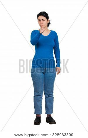 Full Length Portrait Of Serious Young Woman Pointing Index Finger Showing To Camera, Like Choosing S