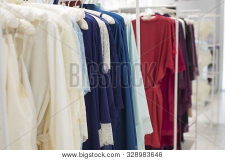 Close-up, Womens Fashion Lingerie Store. Racks, Hangers With Womens Clothing