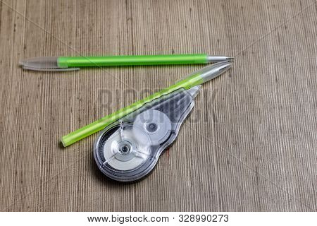 Wooden Background. Handle Them 2 Pieces. And Corrector For Fixing Errors