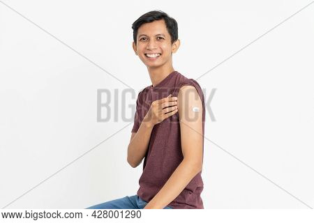 Asian Patient Getting Vaccinated Against Coronavirus By Doctor