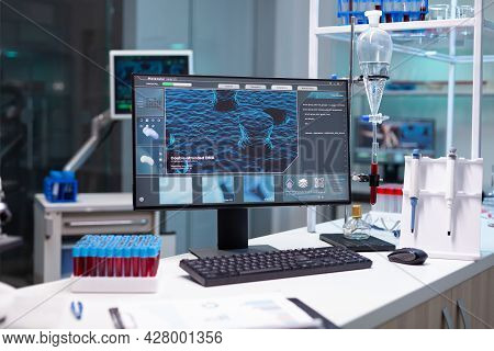 Computer With Microbiology Virus Expertise On Display Standing On Table During Medicine Biochemistry