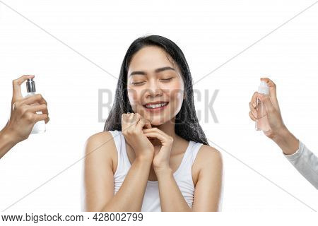 Smiling Asian Woman Wearing White Underdress Closed Her Eyes When Sprayed Two Bottles Of Serum