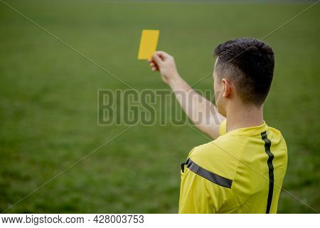 Referee Showing A Red Card To A Displeased Football Or Soccer Player While Gaming. Concept Of Sport,