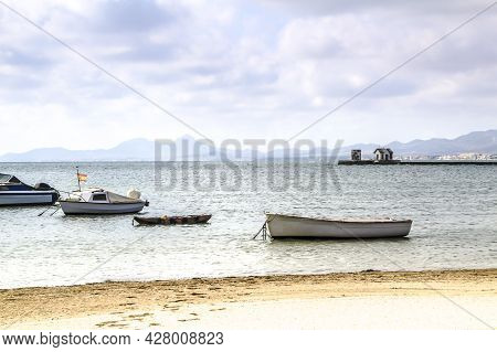 Boats Moored On La Concha Beach In Los Alcazares Village, (murcia Community, Spain) On A Sunny Day O