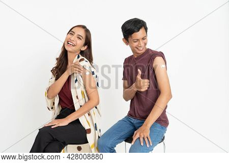 Asian Patient Getting Vaccinated Against Coronavirus By Doctor