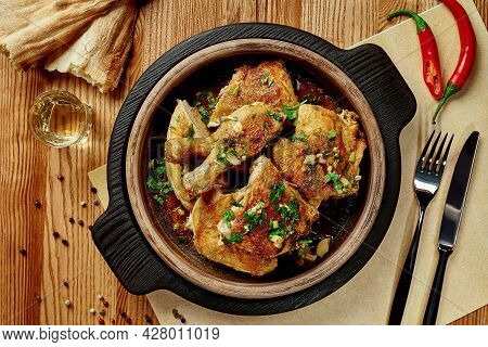 Fried Chicken In Garlic Sauce With Greens, Shotis Puri And Chacha