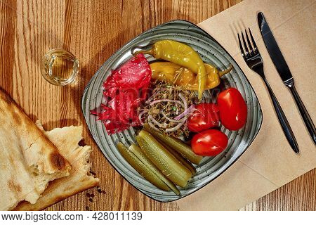 Platter With Traditional Georgian Pickles With Shotis Puri And Chacha