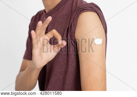 Asian Patient Getting Vaccinated Against Coronavirus By Doctor