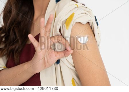 Asian Patient Getting Vaccinated Against Coronavirus By Doctor