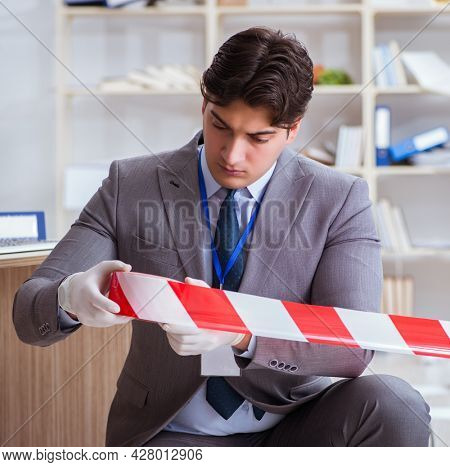 Young man during crime investigation in office