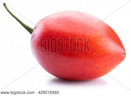 One ripe tamarillo fruit isolated on a white background.