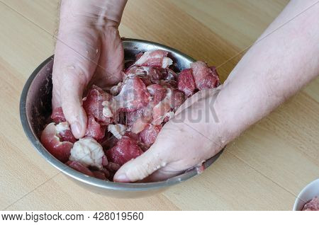 Step By Step Preparation Of Homemade Chopped Ham. Step 8: The Man Carefully Mixes The Meat, Minced M
