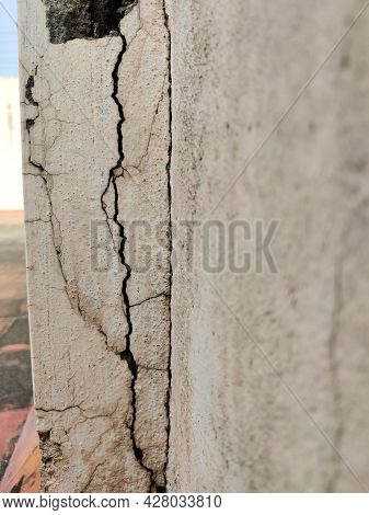 Severe Conditions Of White Wall With Lengthy Cracked Texture. Old Apartment/house