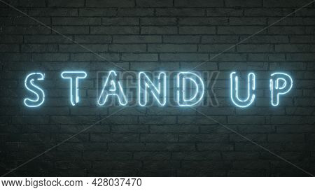 Glowing Stand Up Emblem On Black Brick Wall Background. 3d Rendering