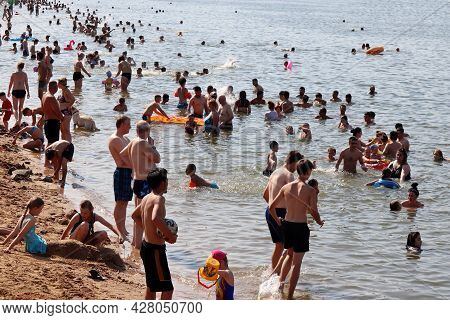 Moscow, Russia - July 2021: Crowd Of People Swimming In Moscow River In Strogino. Hot Weather, Summe