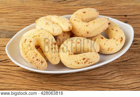 Chipas, Typical South American Cheese Bun In A White Plate Over Wooden Table.