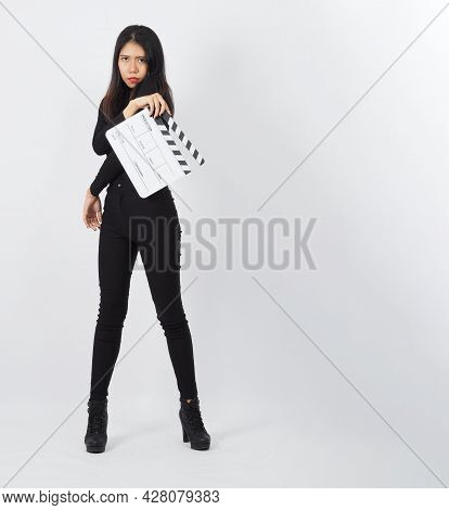 Asian Woman Is Holding White Clapper Board Or Movie Clapperboard Use In Video Production ,film, Movi