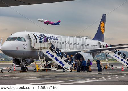 People Boarding To Lufthansa Plane