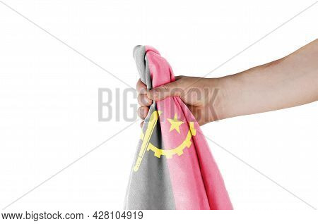 The National Flag Of The Republic Of Angola Is In His Hand On A Colored Background. A Man Is Holding