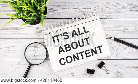 It's All About Content Text Concept Write On Notebook With Office Tools On Wooden Background