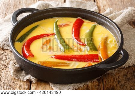 Ema Datshi Bhutanese Chili And Cheese Stew Closeup In The Pan On The Table. Horizontal