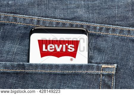 Galicia, Spain, July 27, 2021: Smartphone In Pocket Jeans With Levi´s Logo On Screen