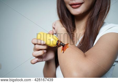 Beautiful Young Woman Applying Medicine To Yuang's Injured Hand