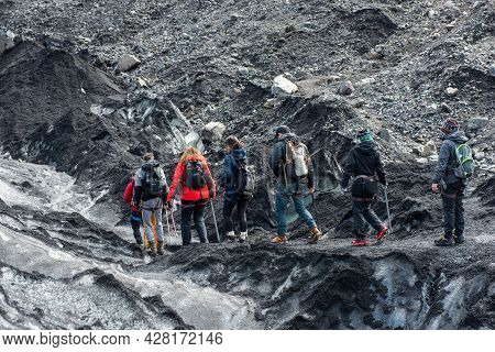Tourists Hiking At Solheimajokull Glacier, Iceland