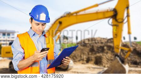 Construction manager working in an escavation site