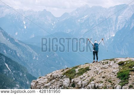 Backpacker Woman With Backpack Enjoying The Turquoise Lago Di Sorapiss 1,925m Altitude (mountain Lak