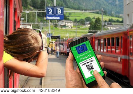 Man In A Train Station Is Holding Smartphone With The European Union Digital Green Pass For Covid-19