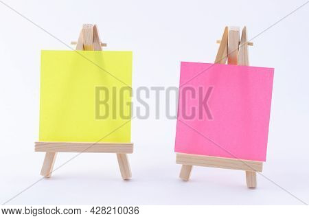 Two Wooden Easels Miniature With Blank Colored Square Canvas Or Memo Paper - Mockup. Mini Wooden Sta