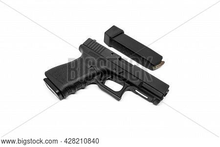 9mm Pistol And Loaded Magazine On White Background