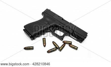 9mm Pistol And Bullets On White Background