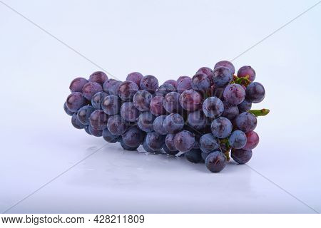 Kyoho Grapes (giant Mountain Grapes) , With Some Grapes Scattered Out In Front. Isolated On White.