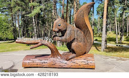 Latvia, Riga, July, 2021 - A Squirrel Carved Metal Sculpture In The Technique Of Openwork Wire Weavi