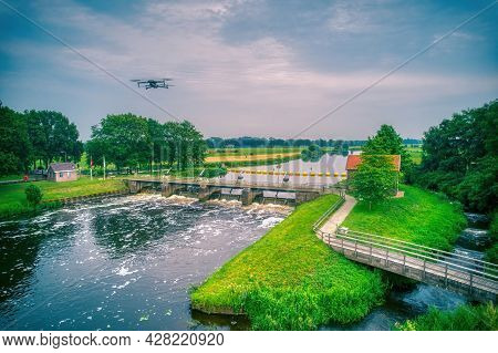 Water Swirls From The Weir In The River Vecht In The Netherlands. Downstream, Lock Keeper's House Ne