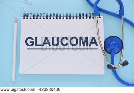 Glaucoma Word Written In Notebook. Glaucoma Text On Light Bluebckground For Your Desing, Concept.