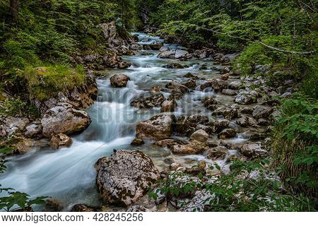 Magic Forest Zauberwald At Lake Hintersee With Creek Ramsauer Ache. National Park Berchtesgadener La