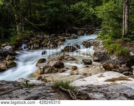 Magic Forest Zauberwald At Lake Hintersee With Creek Ramsauer Ache. National Park Berchtesgadener La