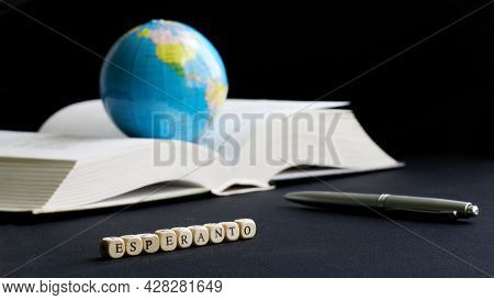 Esperanto Inscription Next To A Globe, An Open Book And A Fountain Pen. The Concept Of Creating, Lea